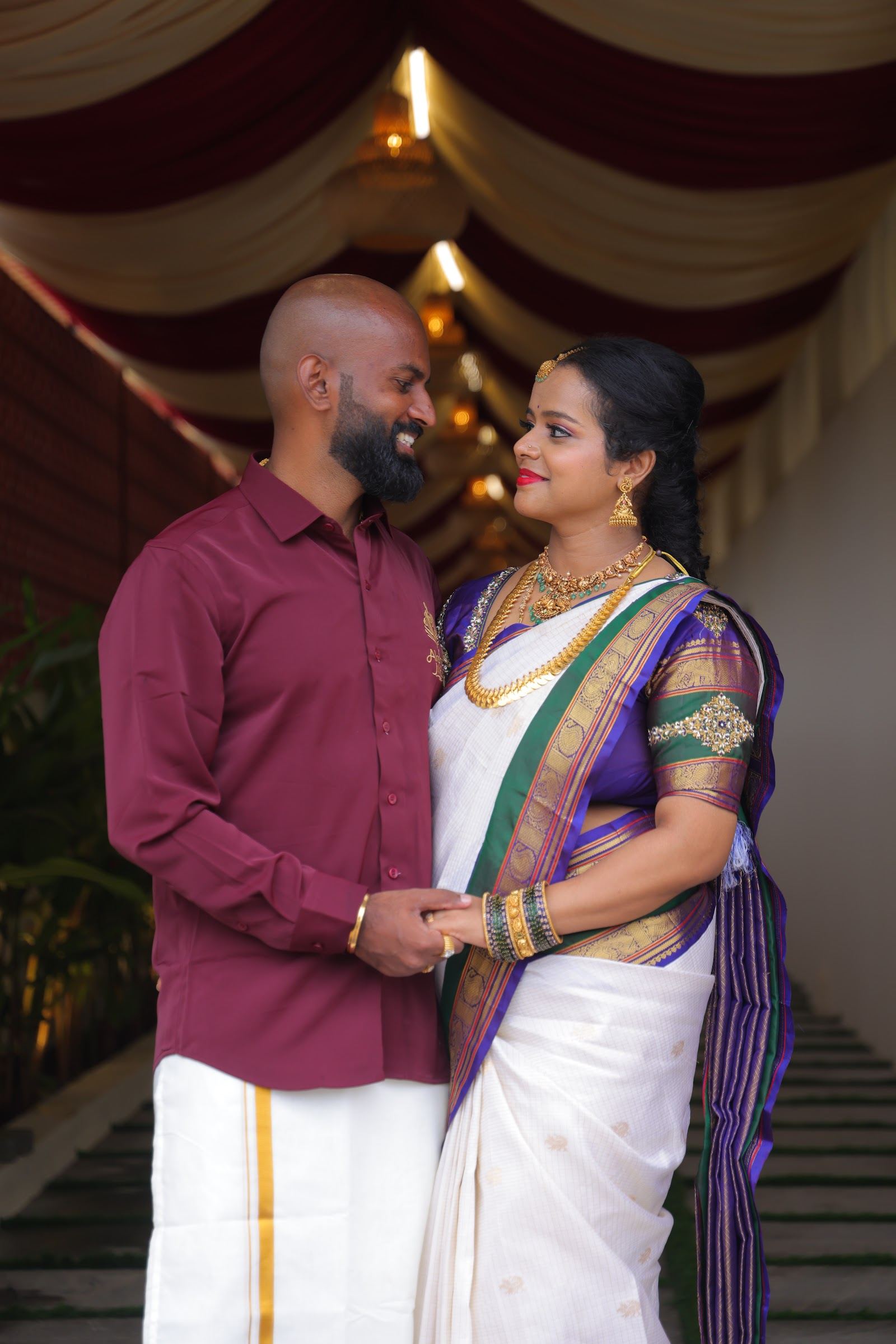 A couple celebrating their wedding at Akshaya Milan, Bengaluru